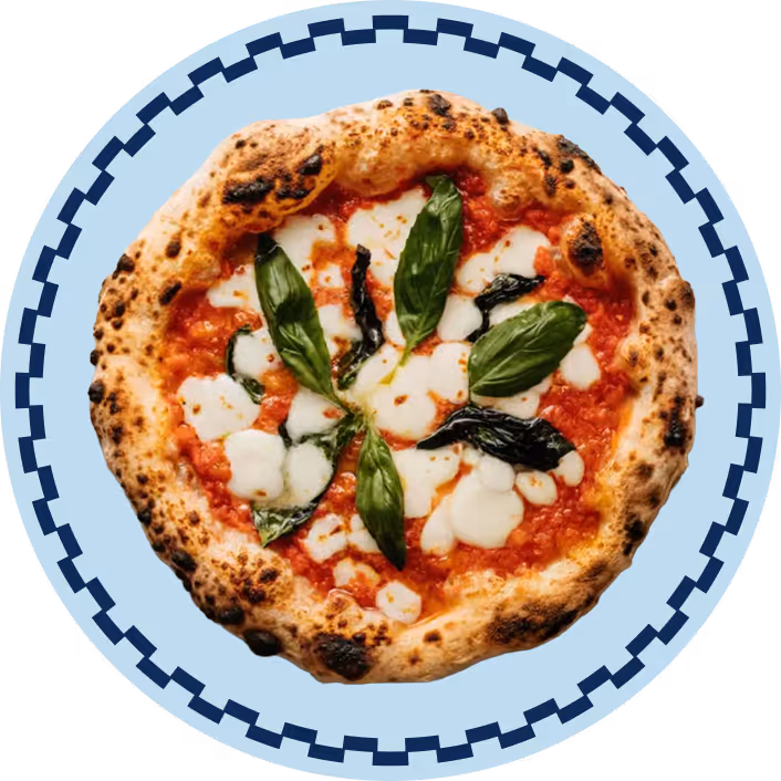 Neapolitan Margherita pizza with tomato sauce, melted mozzarella, and fresh basil on a blue plate with a decorative border.